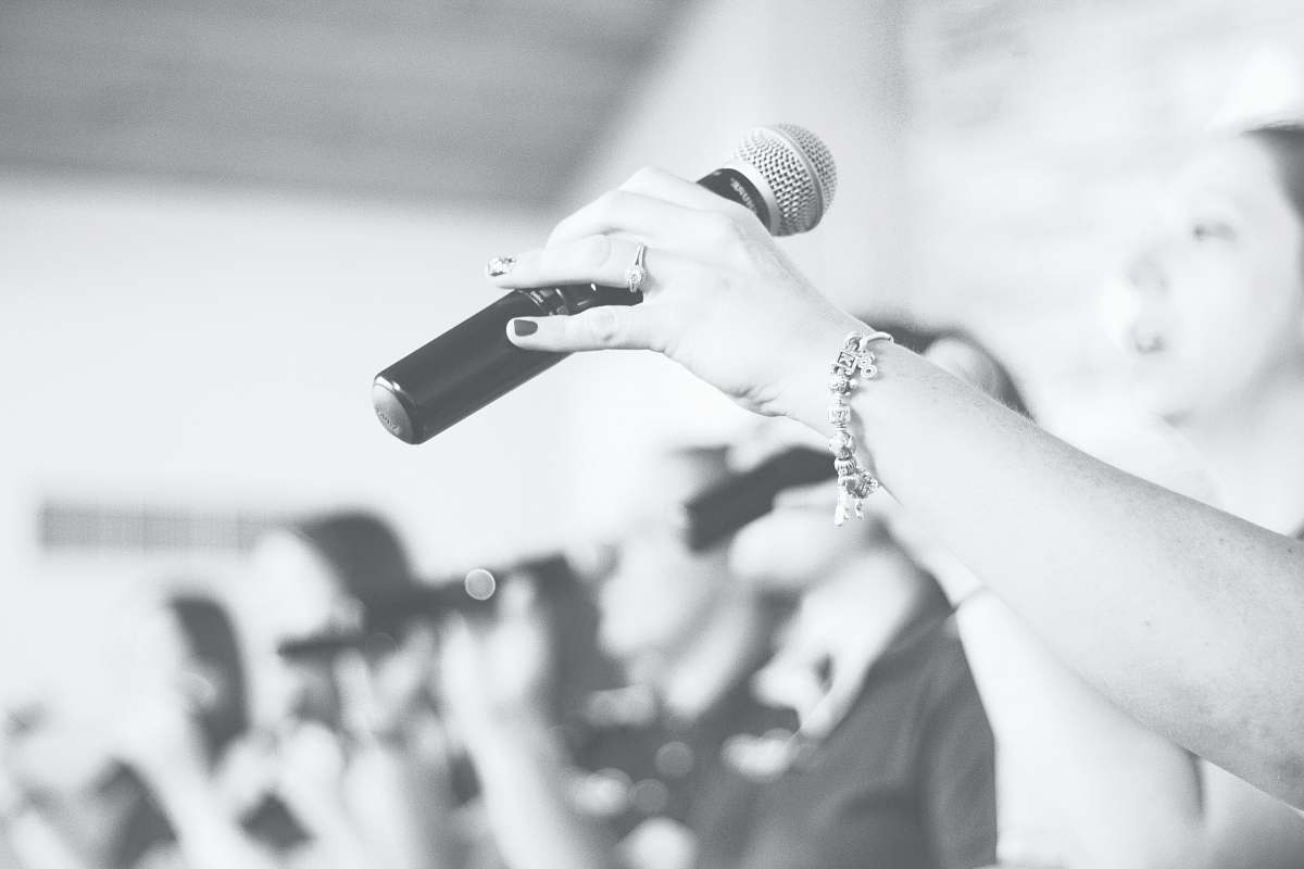 music person holding microphone rockford