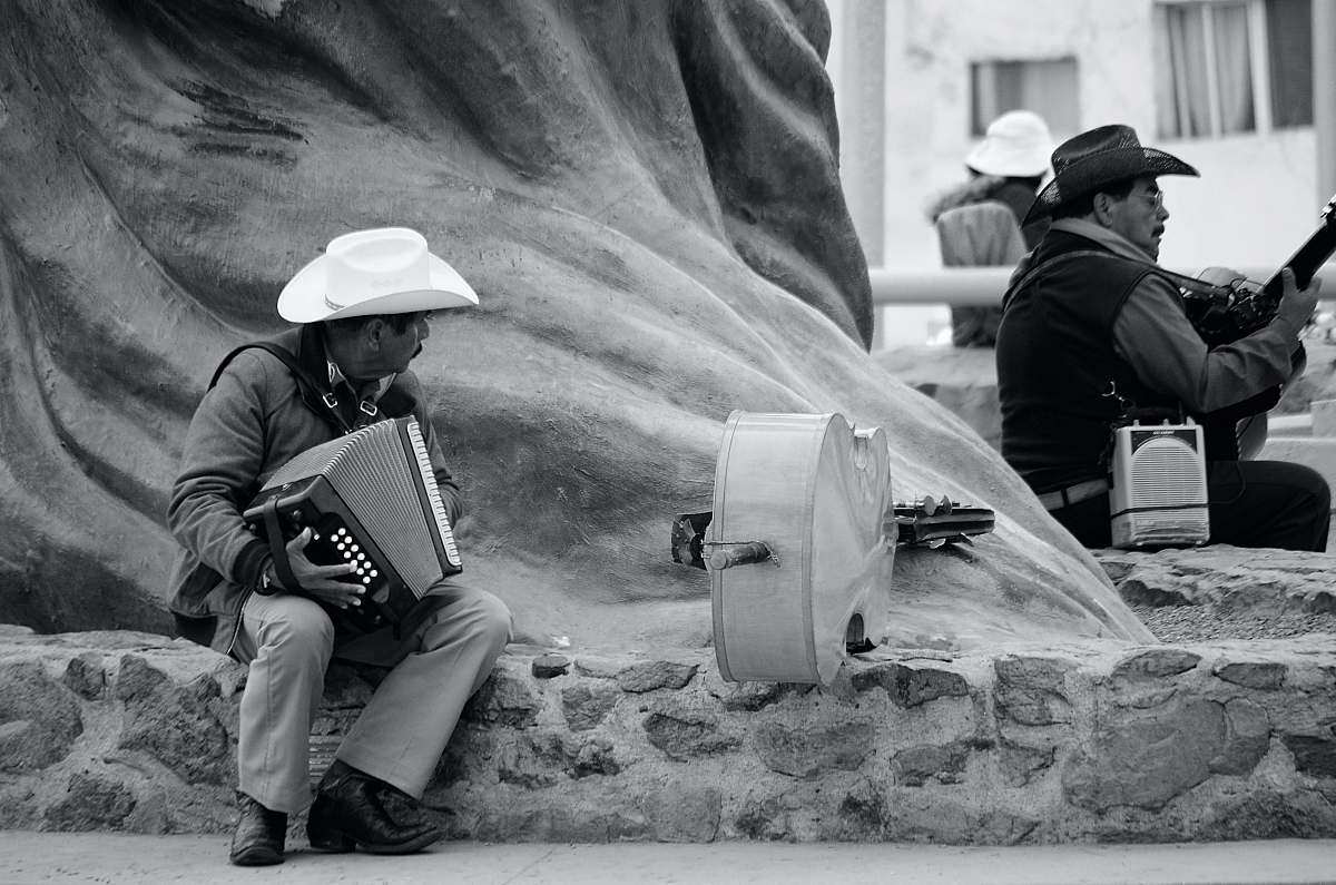 human two men playing musical instruments person