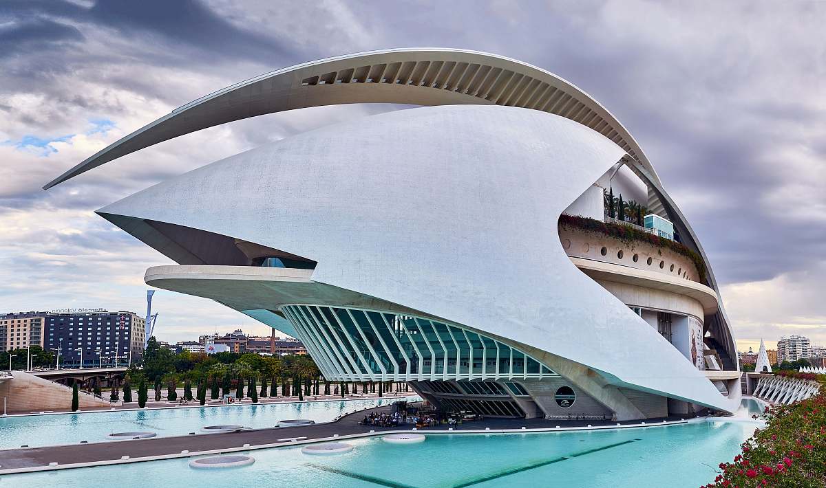 water white concrete building near in-ground pools during cloudy day architecture