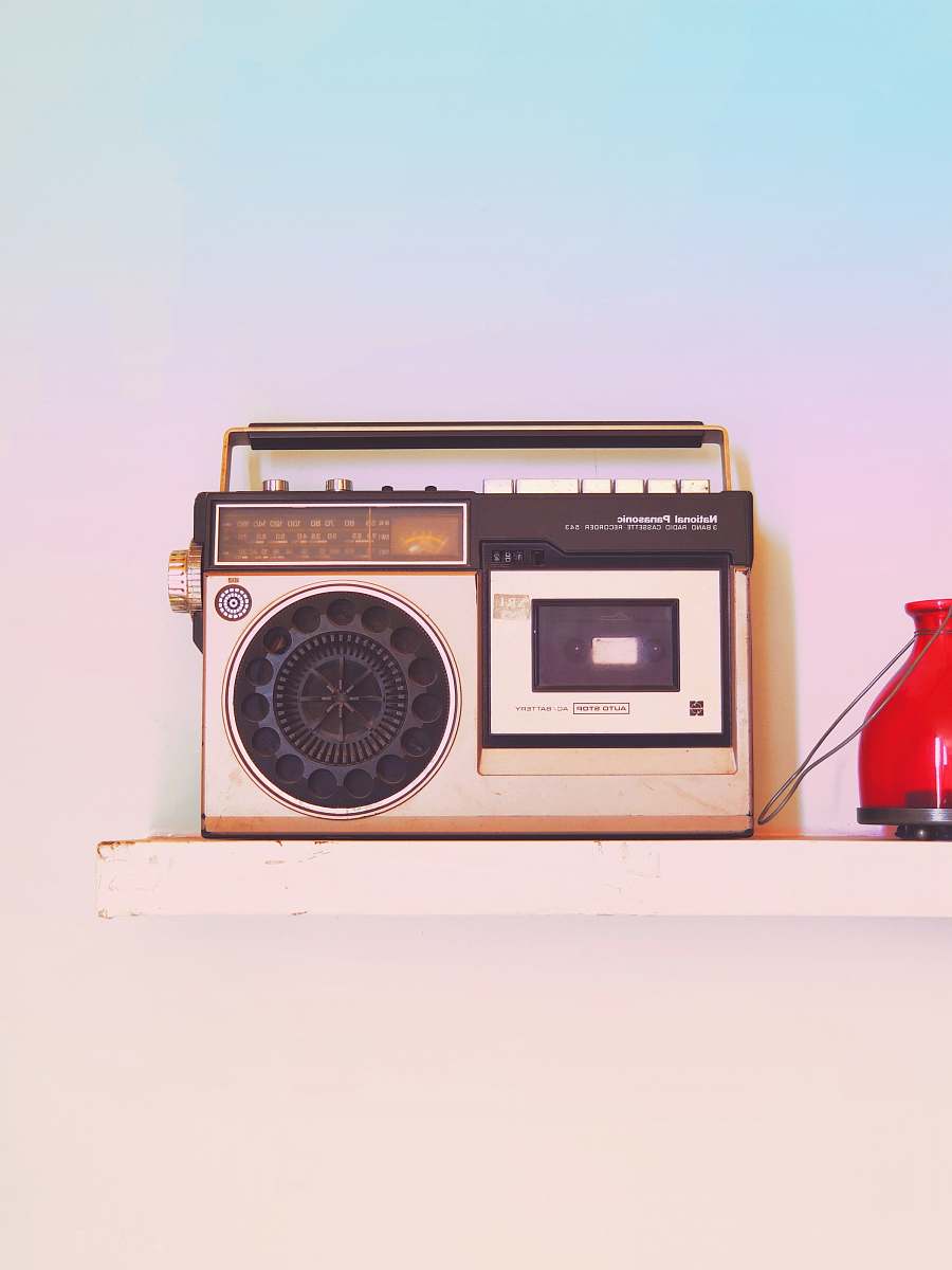 electronics brown and black radio on white table radio