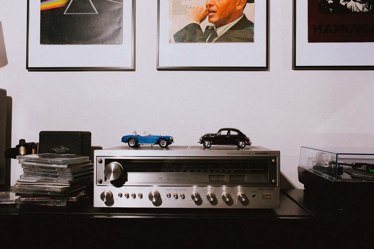 vehicle gray AV receiver on brown wooden table automobile