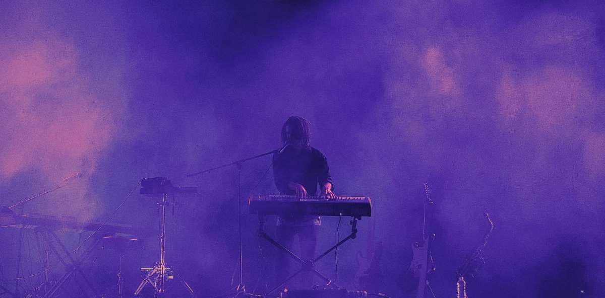 human man playing electronic keyboard person