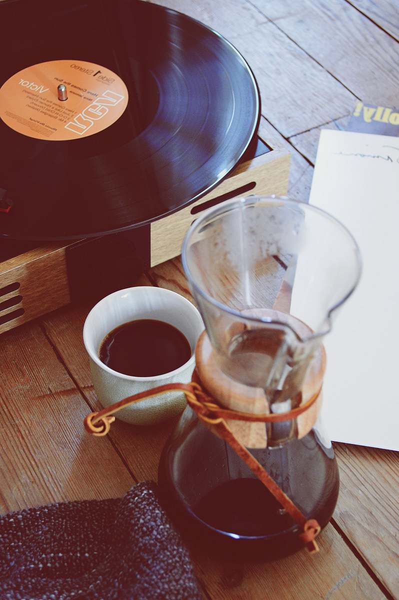 coffee clear glass coffee pitcher beside turntable coffee cup
