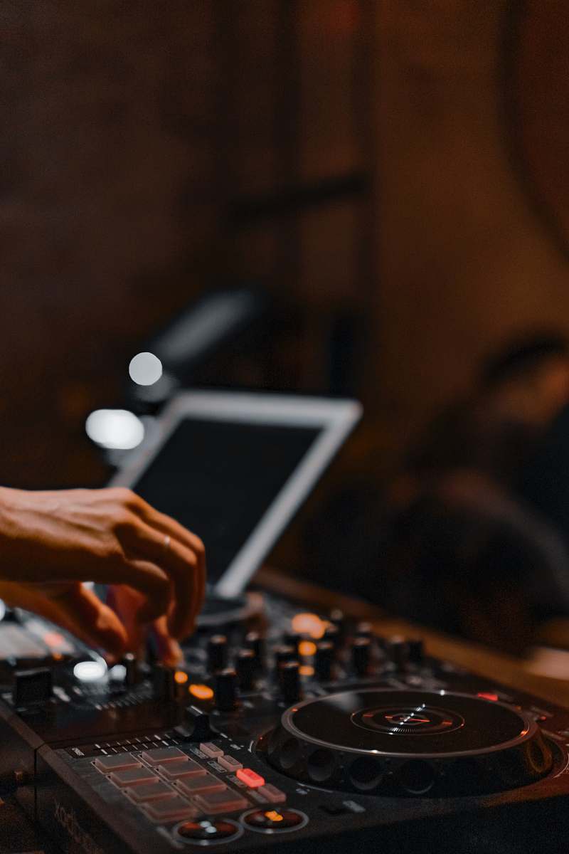 human person using black and gray audio mixer person