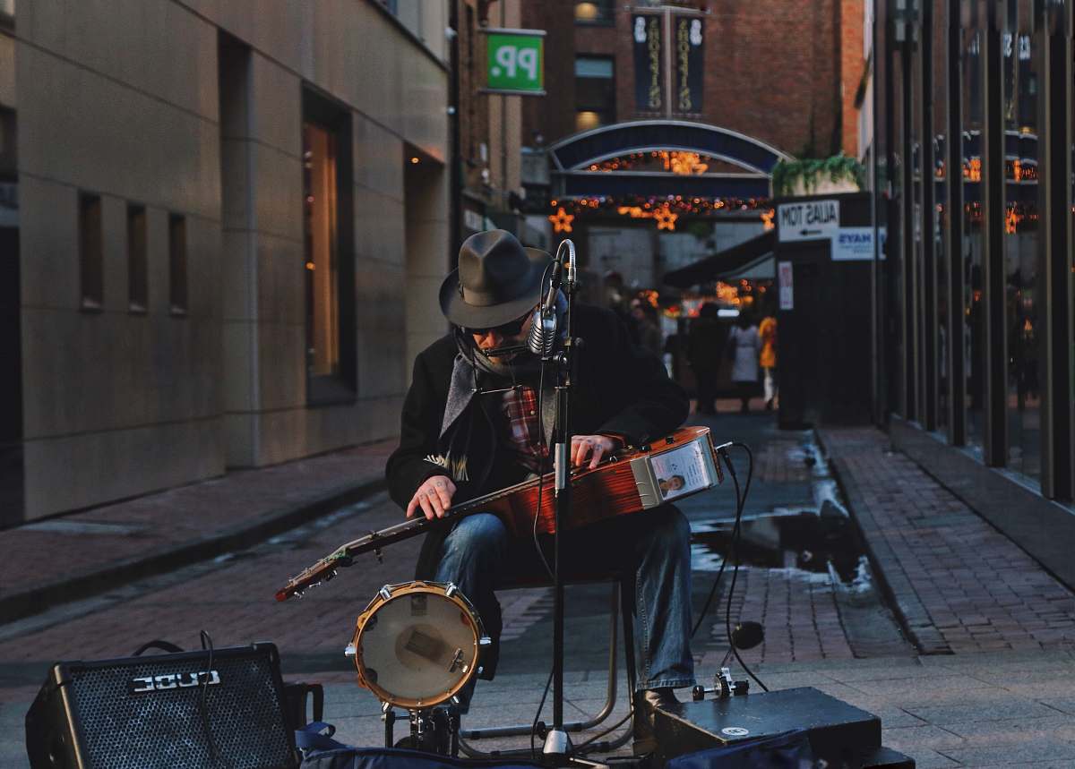 ireland man performing as one-man band on street musician
