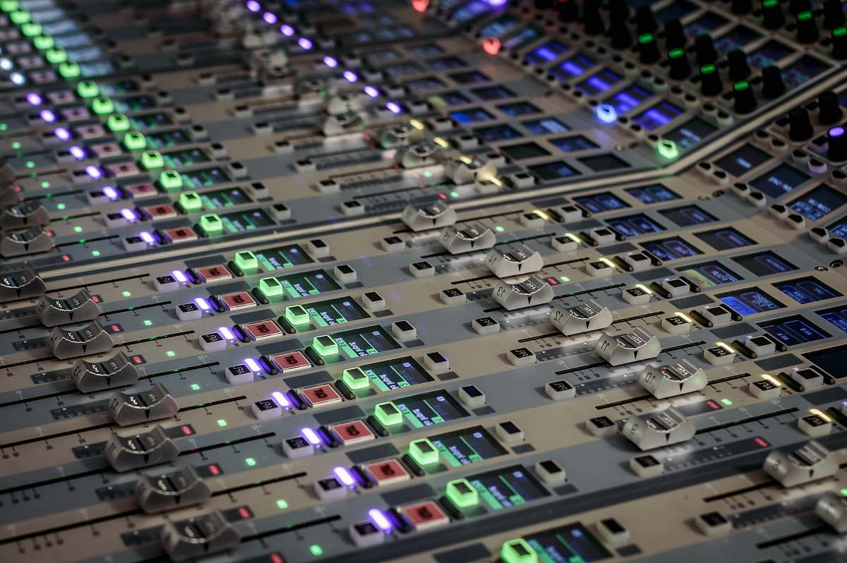 console turned-on white and multicolored audio equalizer fader