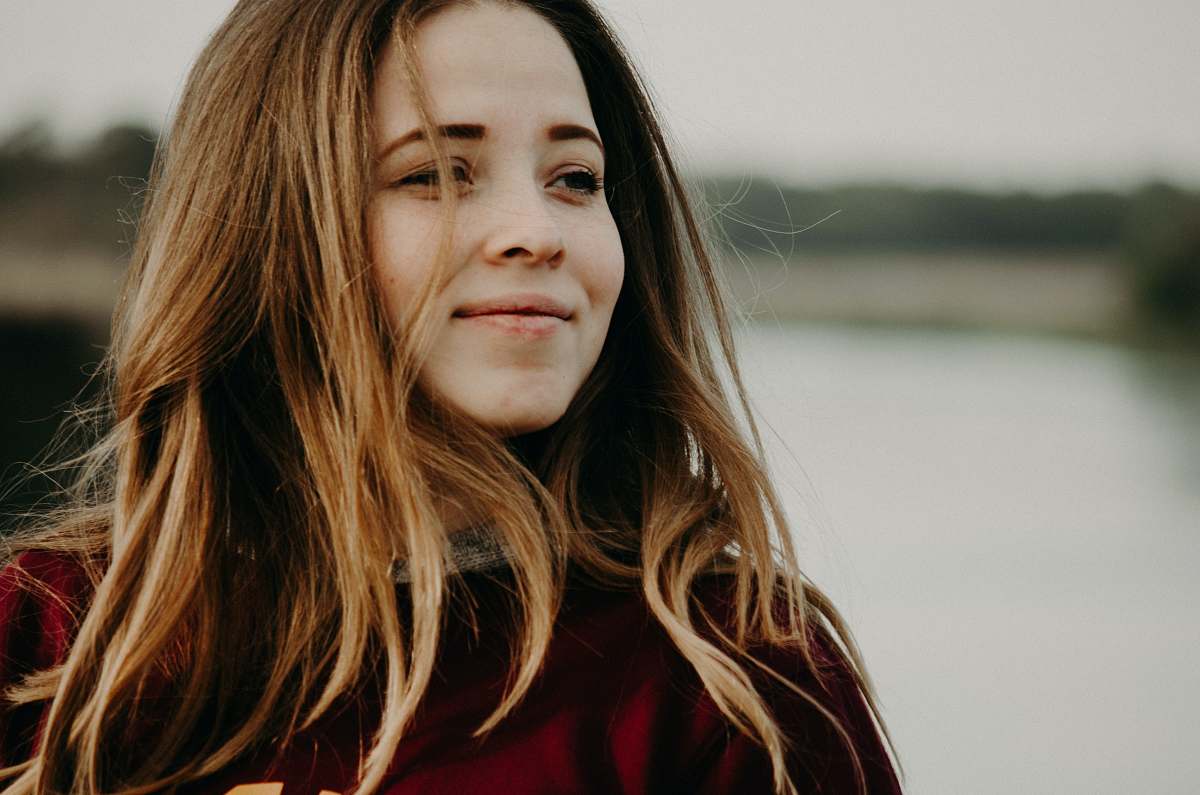 human woman in red turtleneck shirt person