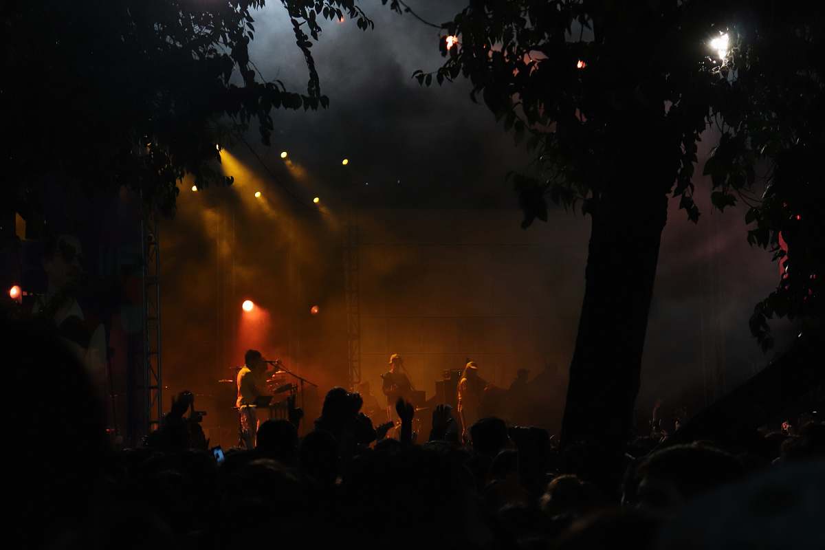 light stage with band performing crowd