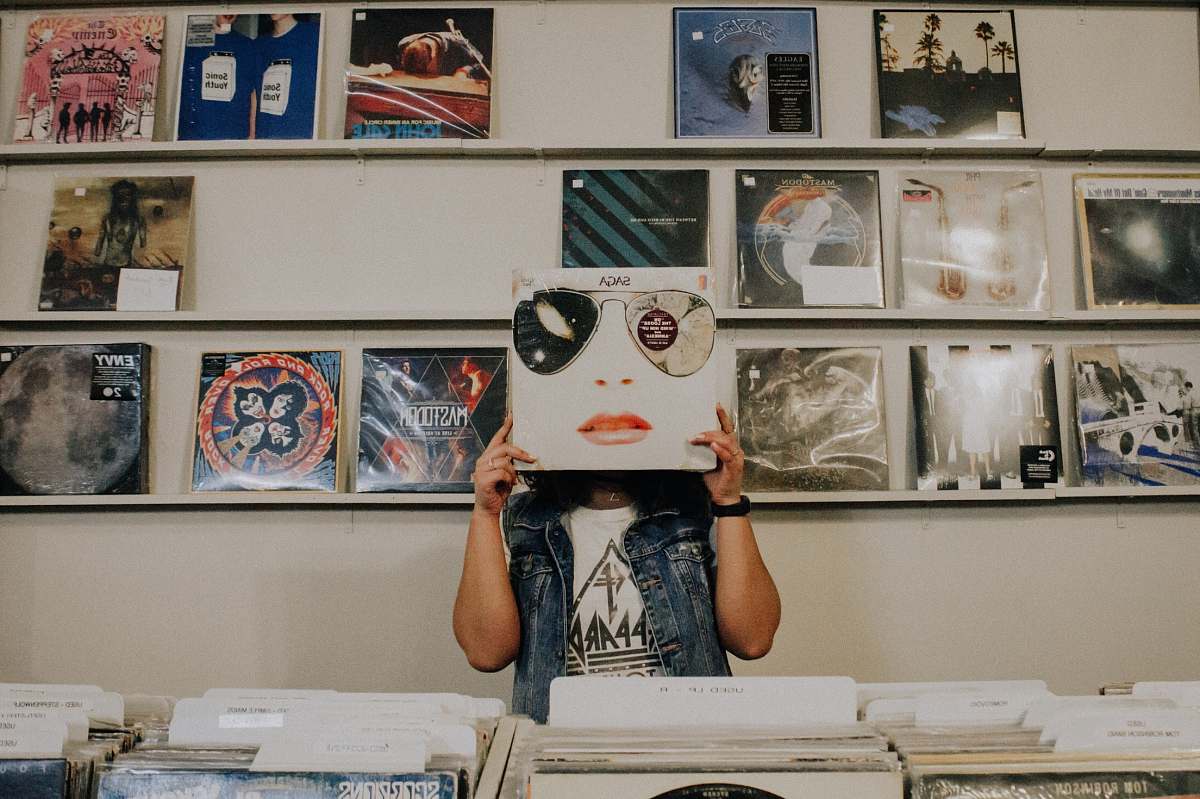 jar person covering face with vinyl sleeve plant