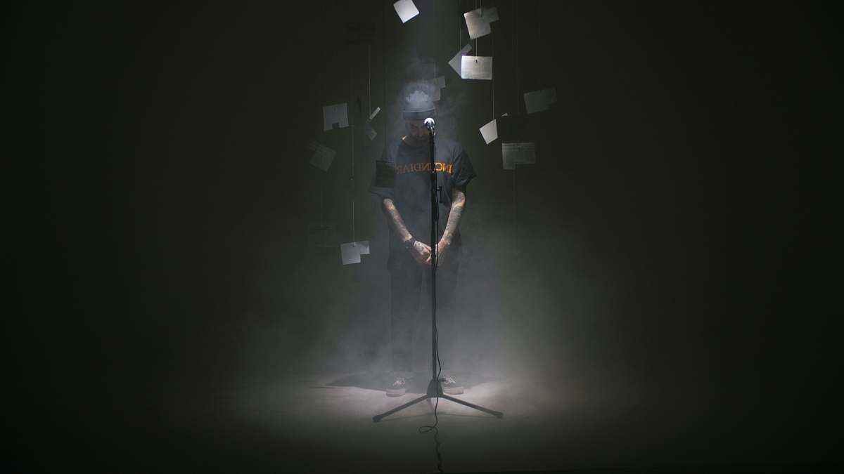 human man standing near microphone person