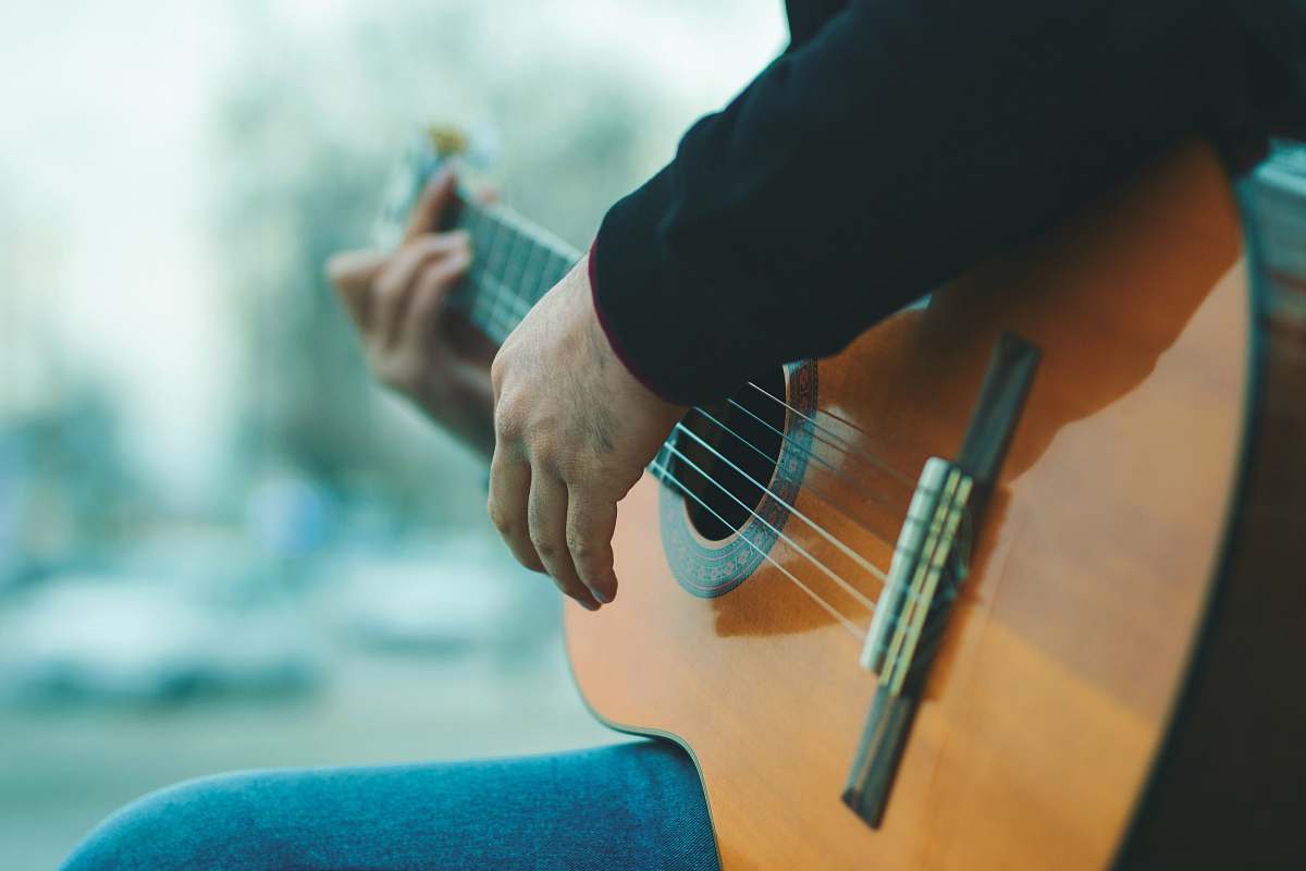 iran person playing guitar cello