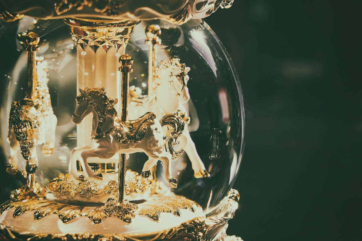 animal horse carousel snow globe mammal