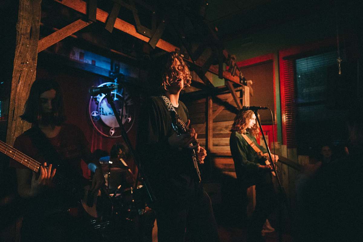 person band performing on stage people