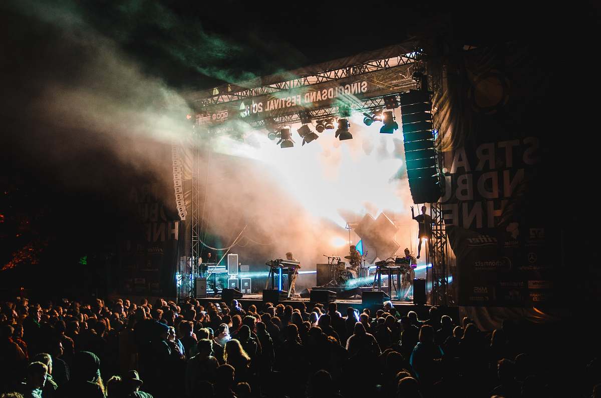 person crowd in front of stage crowd