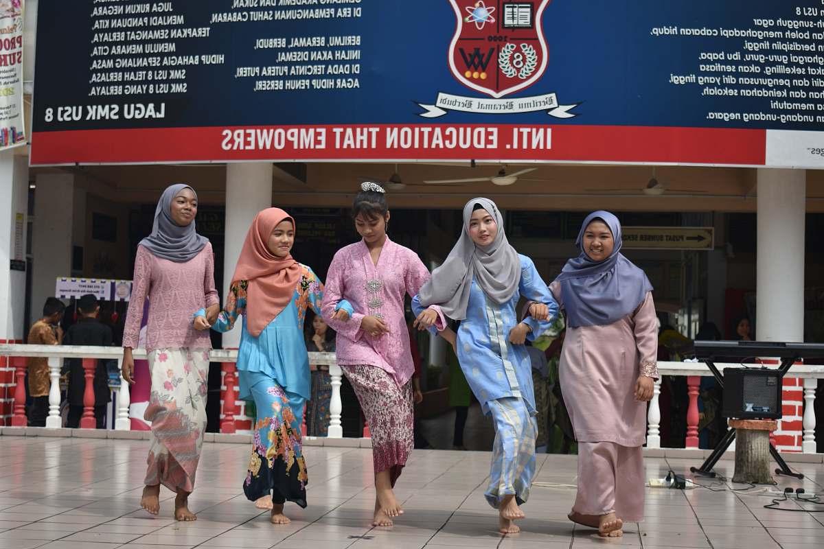 clothing five woman dancing during daytime apparel