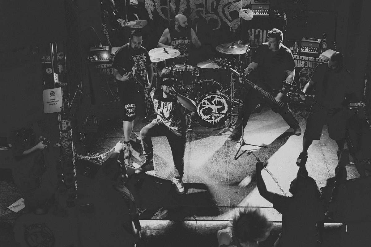 musician grayscle photography of people performing on stage black-and-white