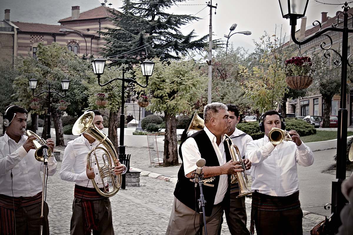 person group of musician standing on hallway brass section