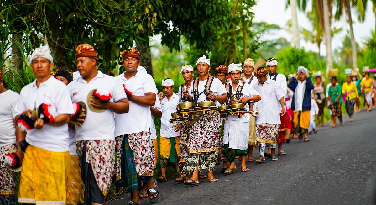 person group of women standing on gray asphalt road during daytime crowd