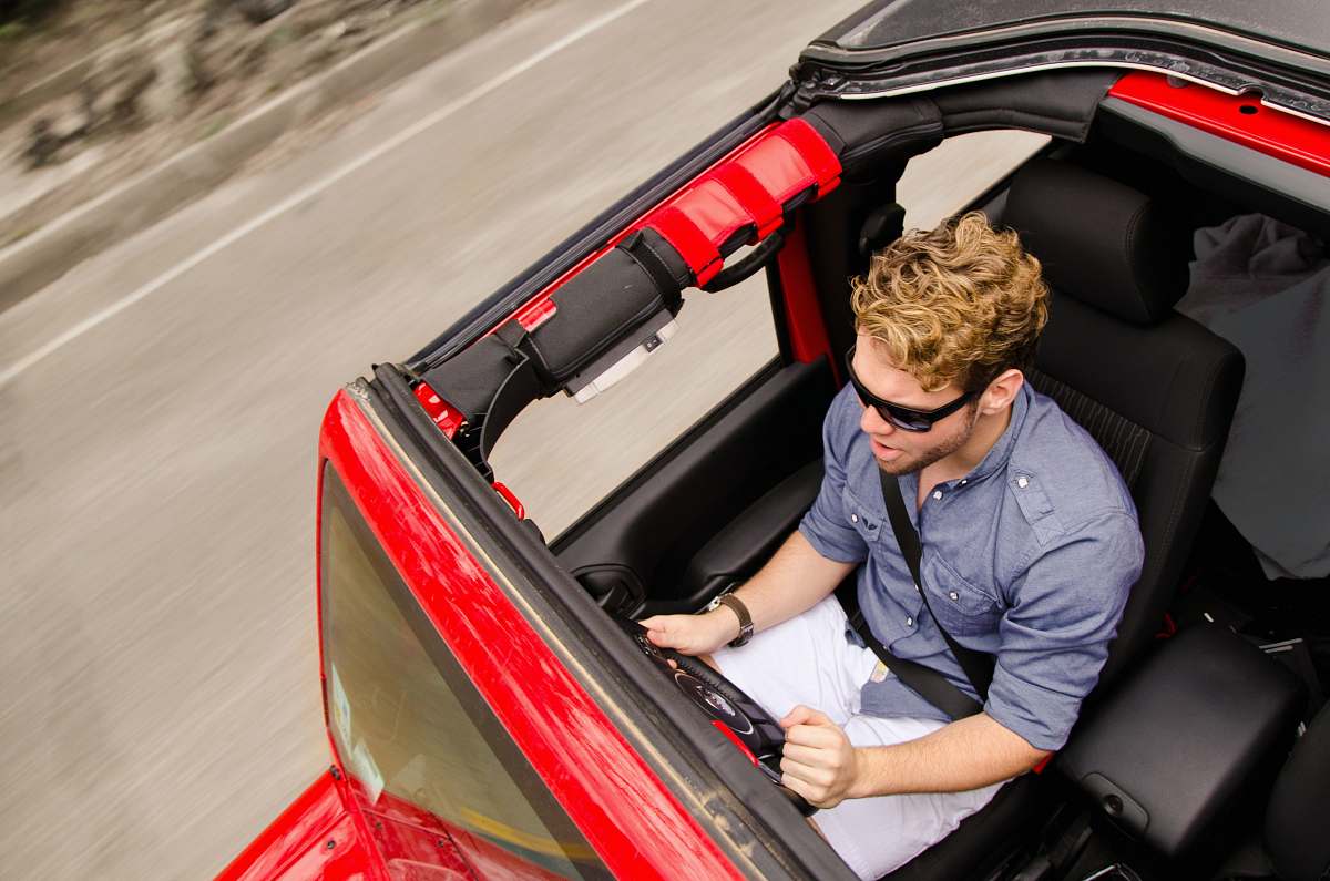 person man driving the vehicle car