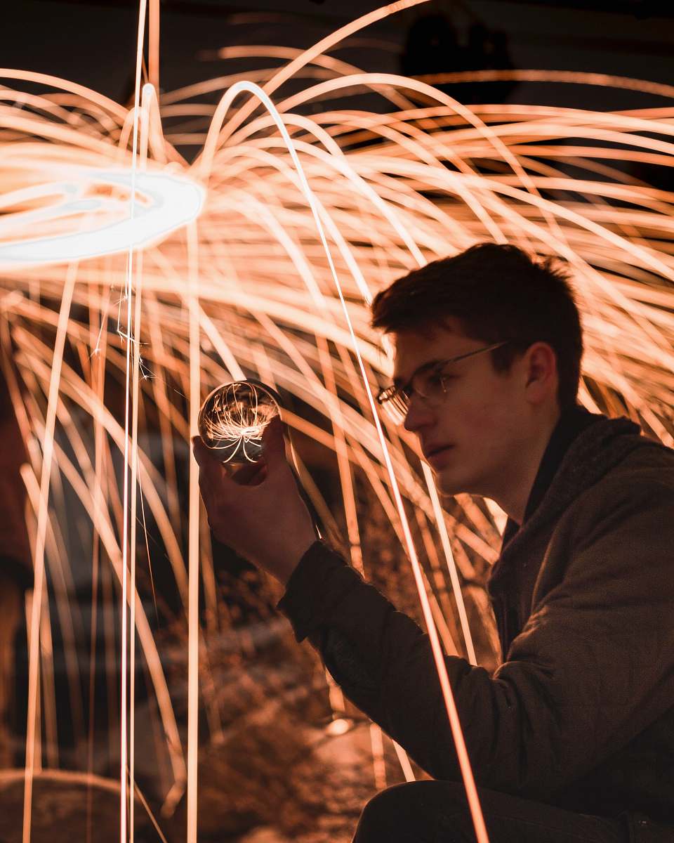 person man holding crystal ball people