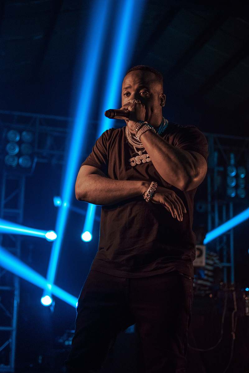people man holding microphone near spot lights person