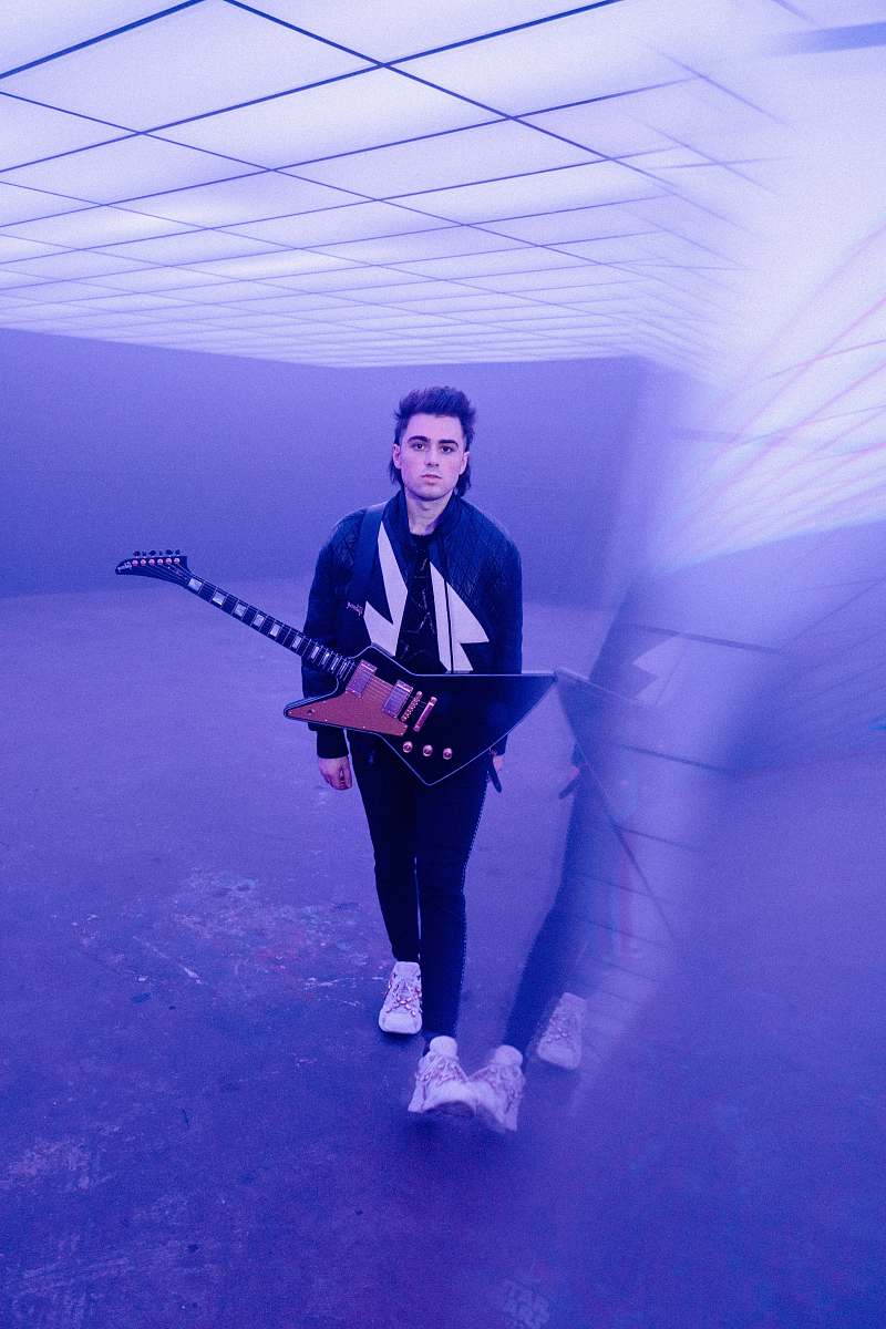 person man holding umbrella guitar