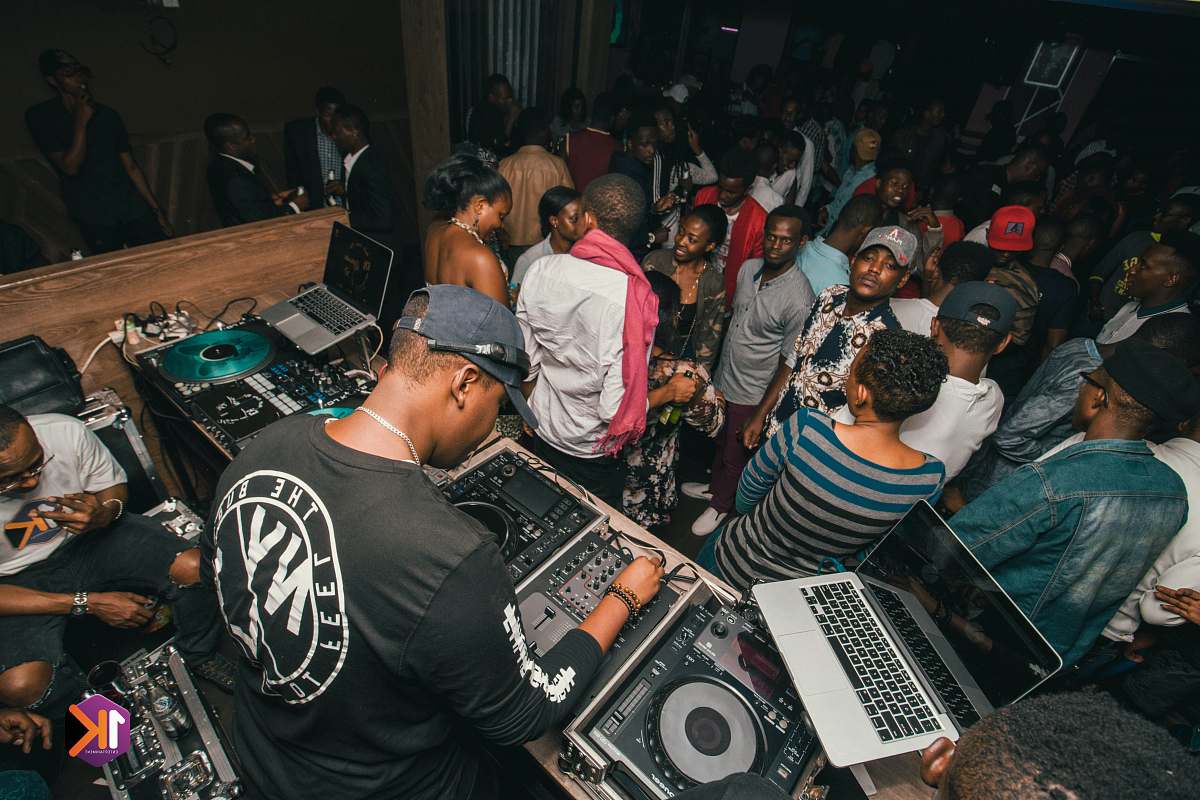 people man in black and white shirt and people dancing inside well lit room person