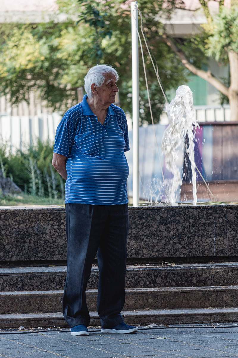 person man in black pants water