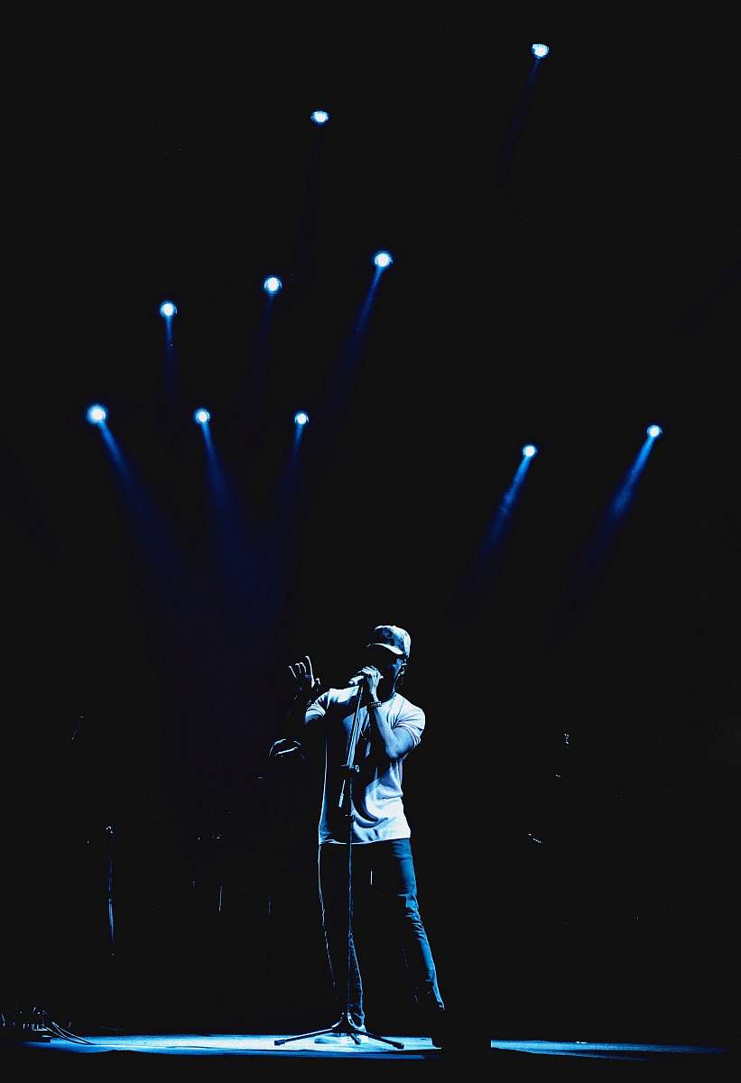 person man performing stage people