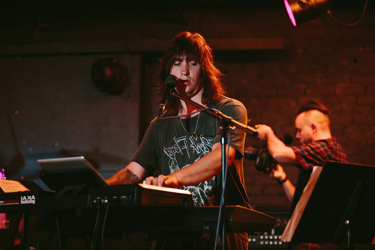 person man playing keyboard musical instrument