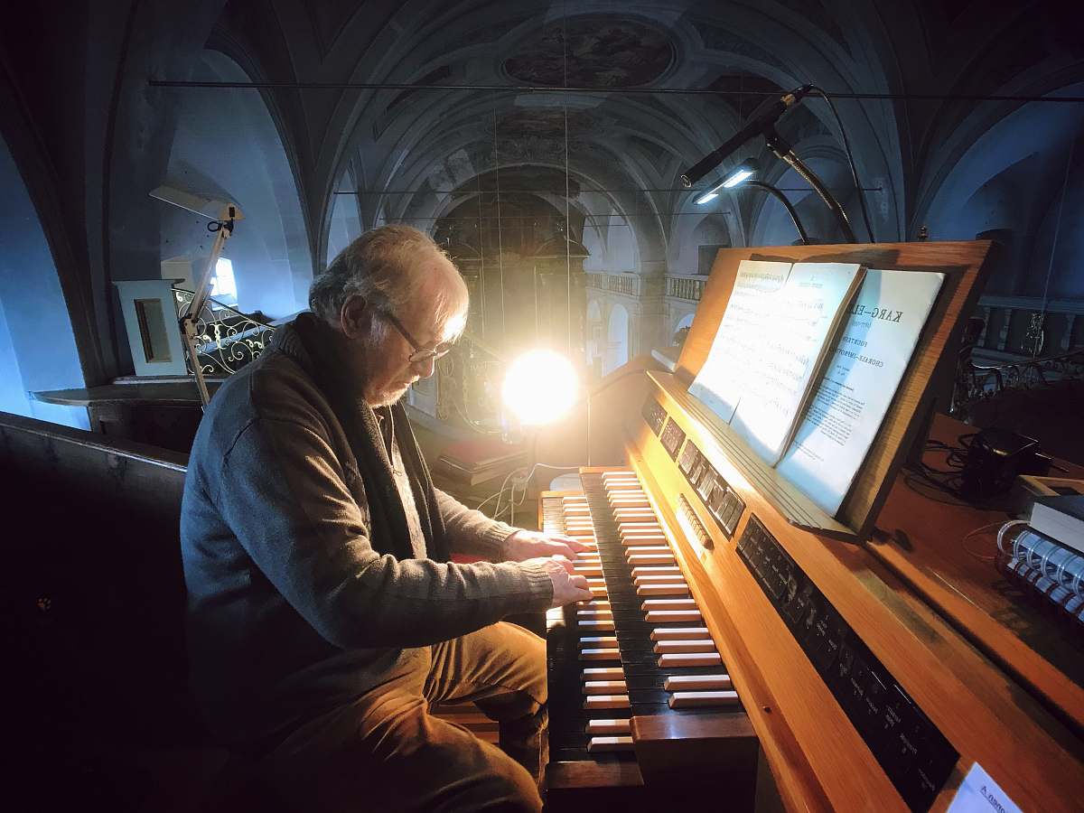person man playing on hammond organ people