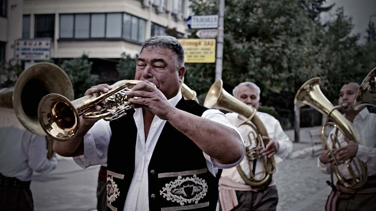 person man playing wind instrument brass section
