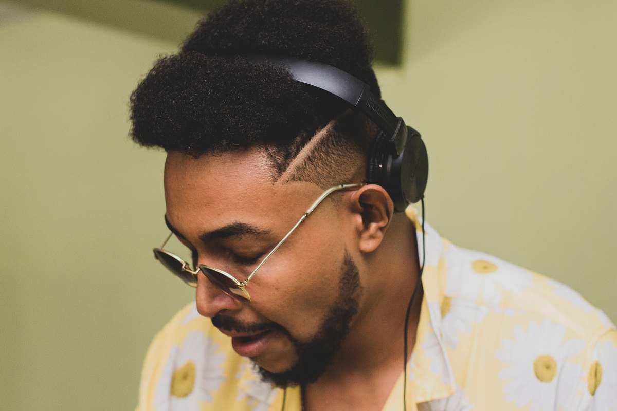 person man wearing sunglasses and headphones headphones