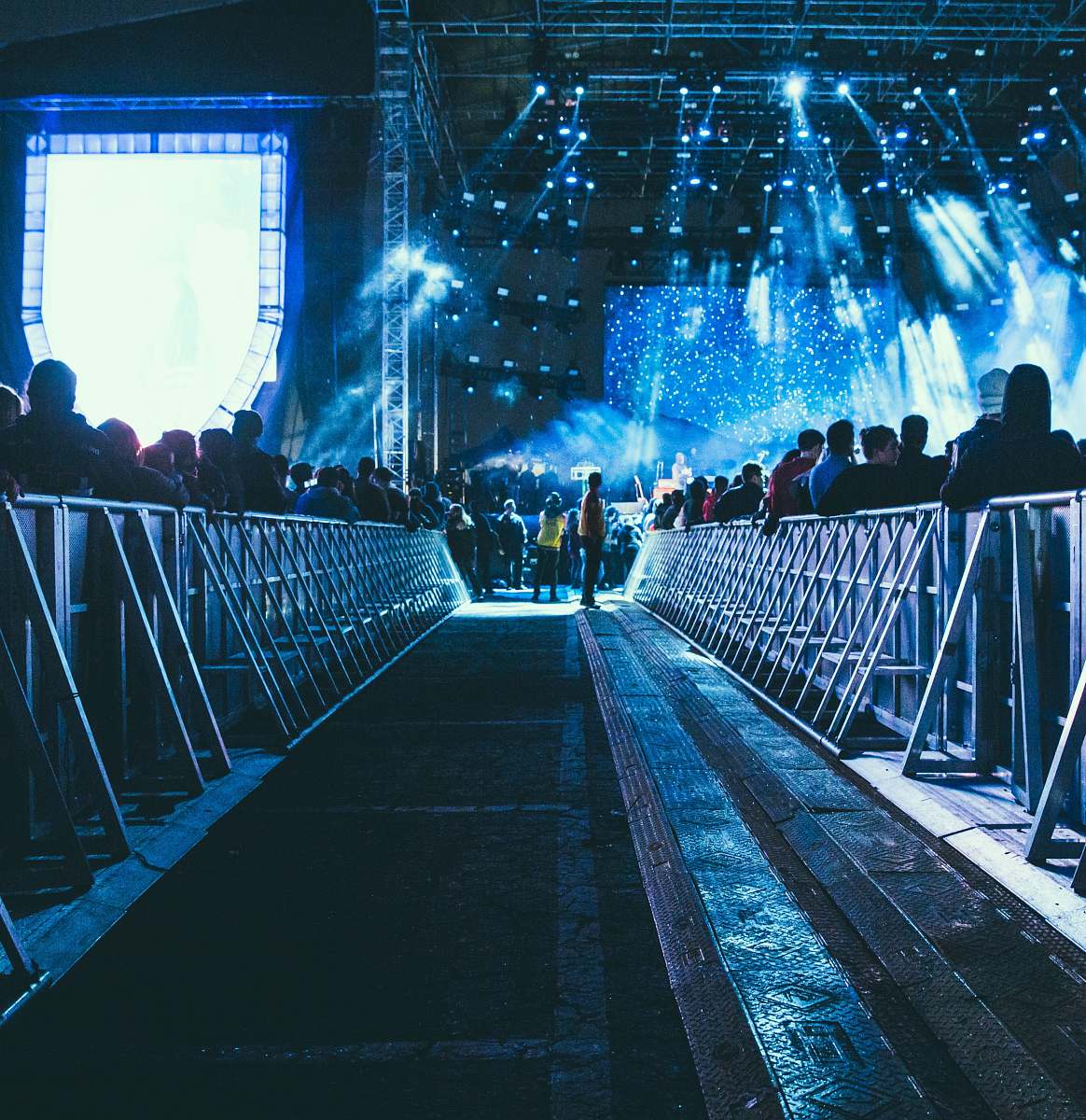 person people walking on wooden bridge stage