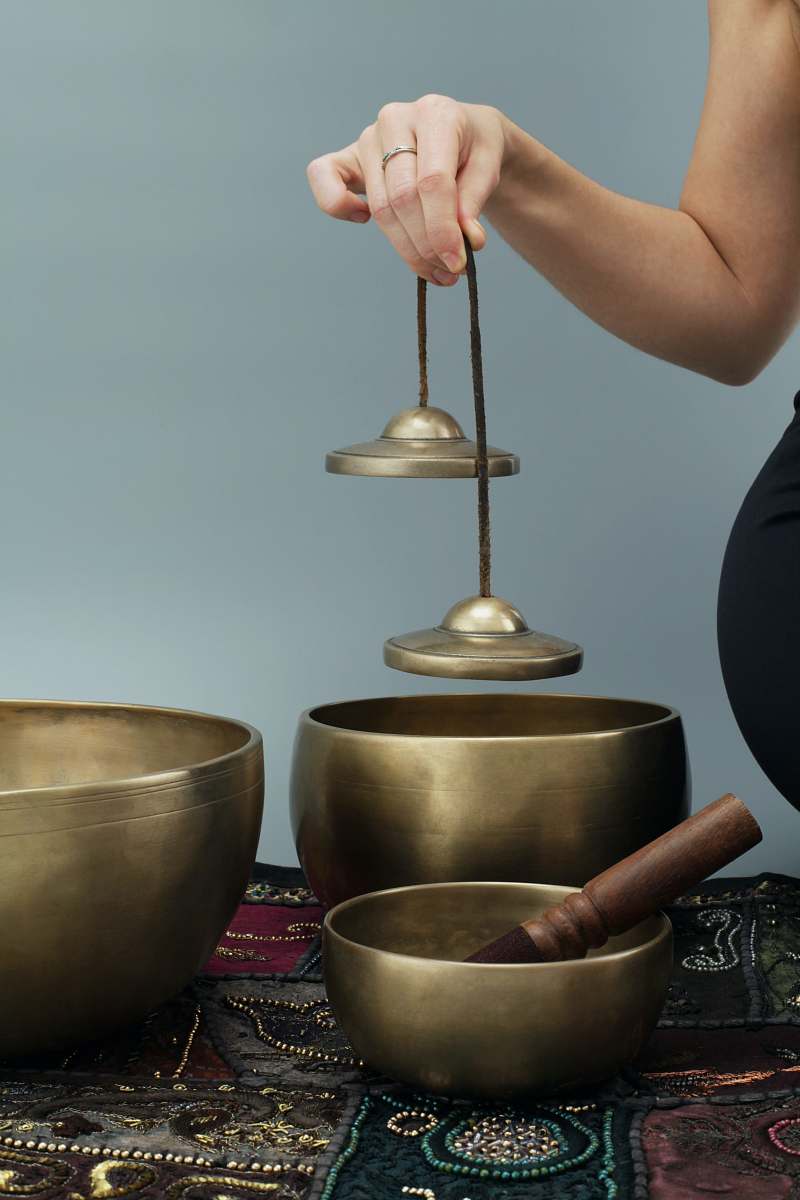 person person holding brown wooden round container bowl