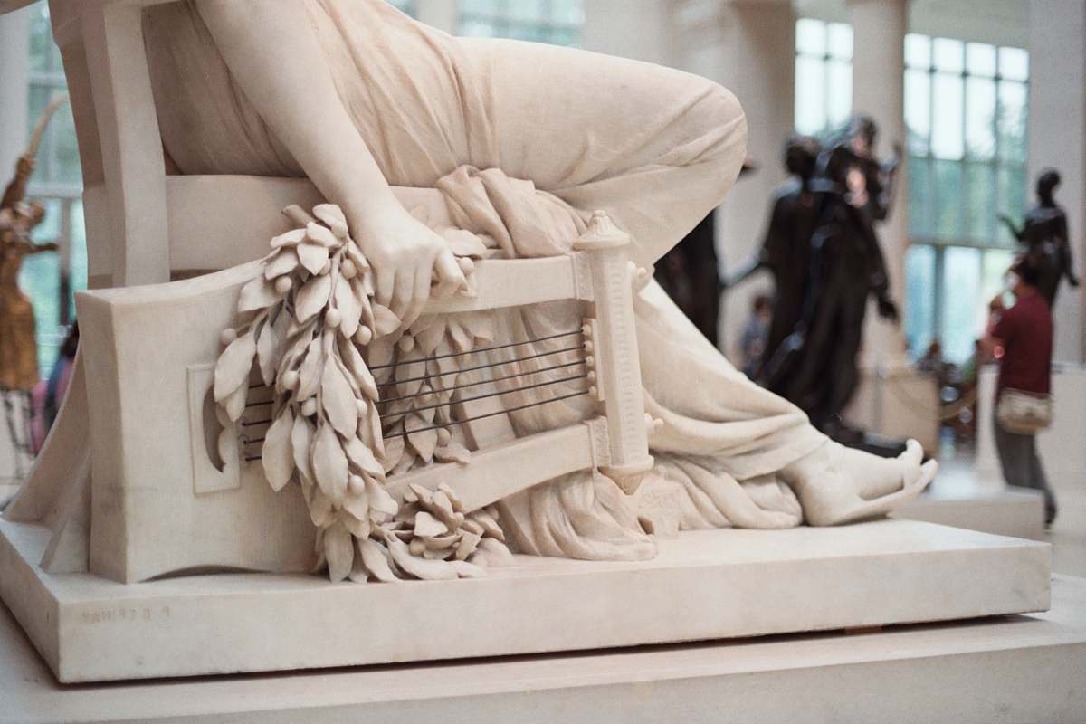 person person sitting on chair statue statue