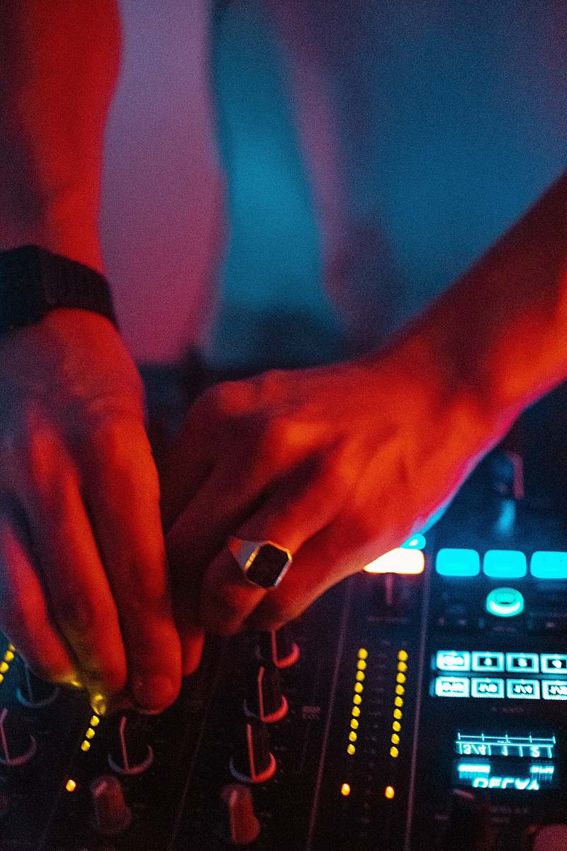 person shallow focus photo of person using turntable dj