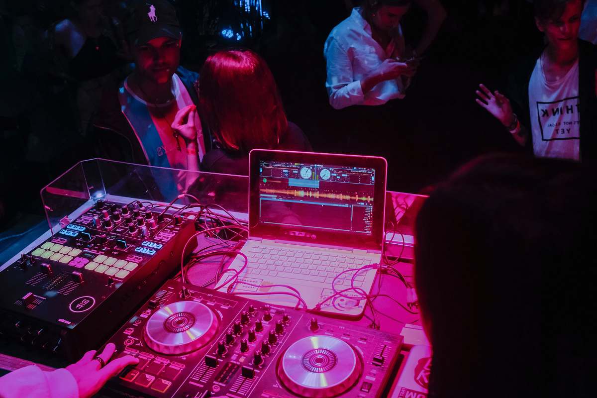 person white laptop and audio system dj