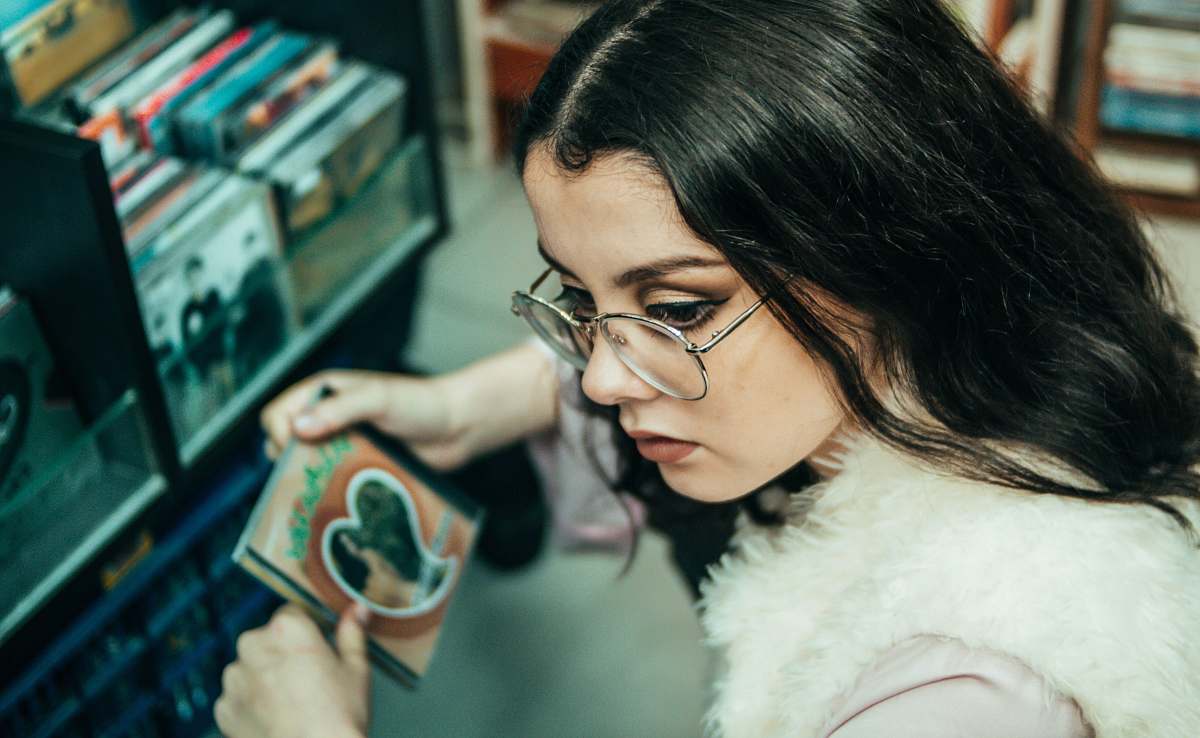 person woman holding CD case people