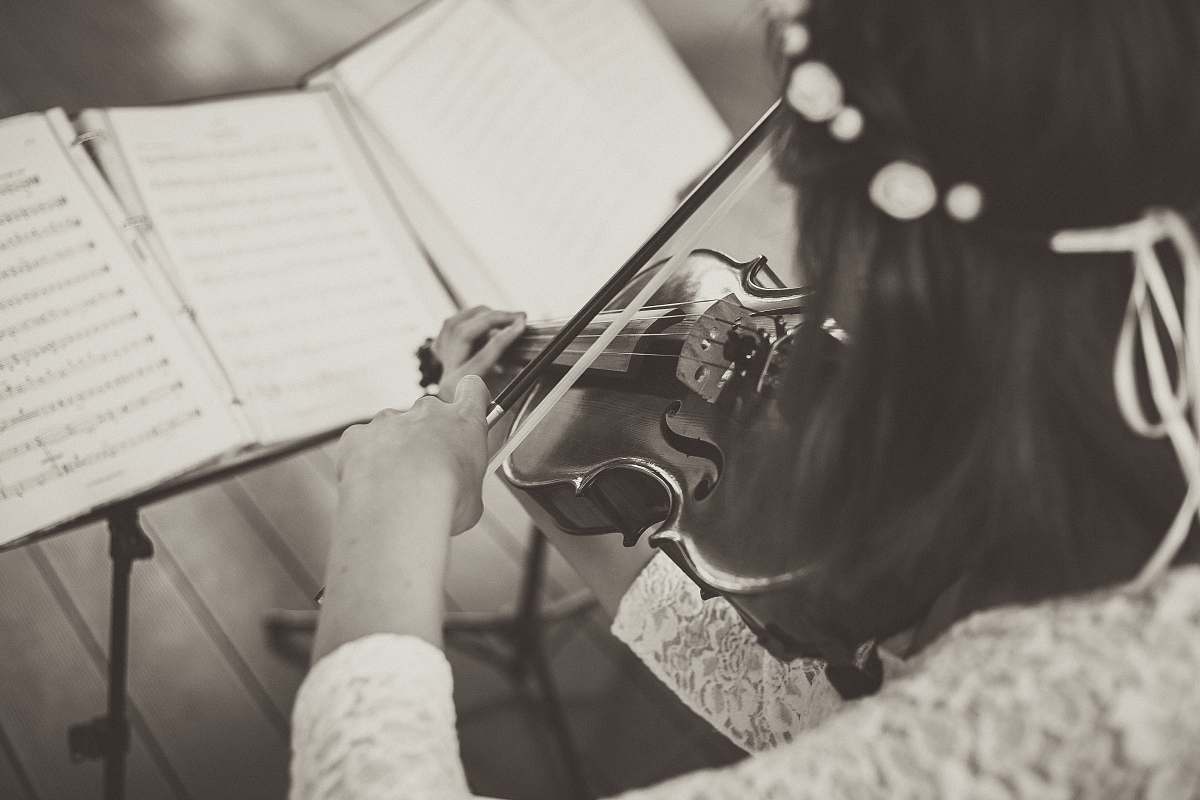 person woman wearing lace top playing violin people