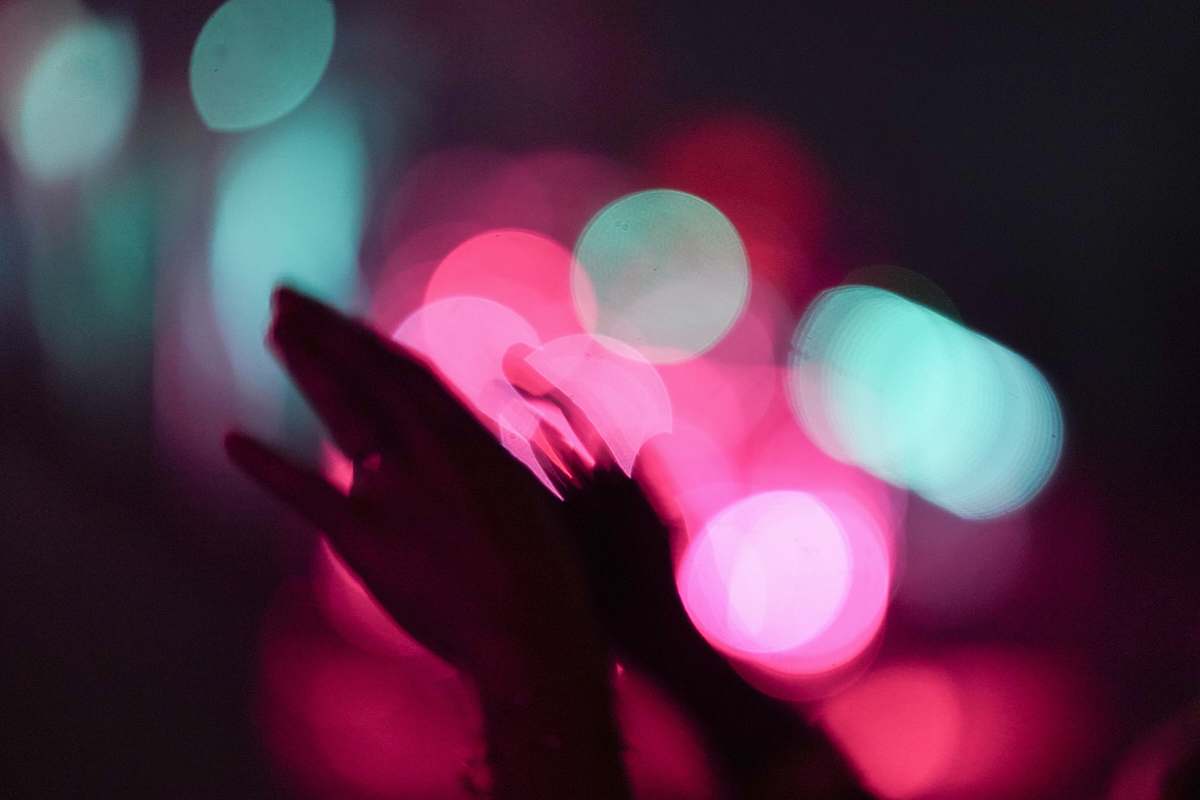 flare macro photography of hands lighting