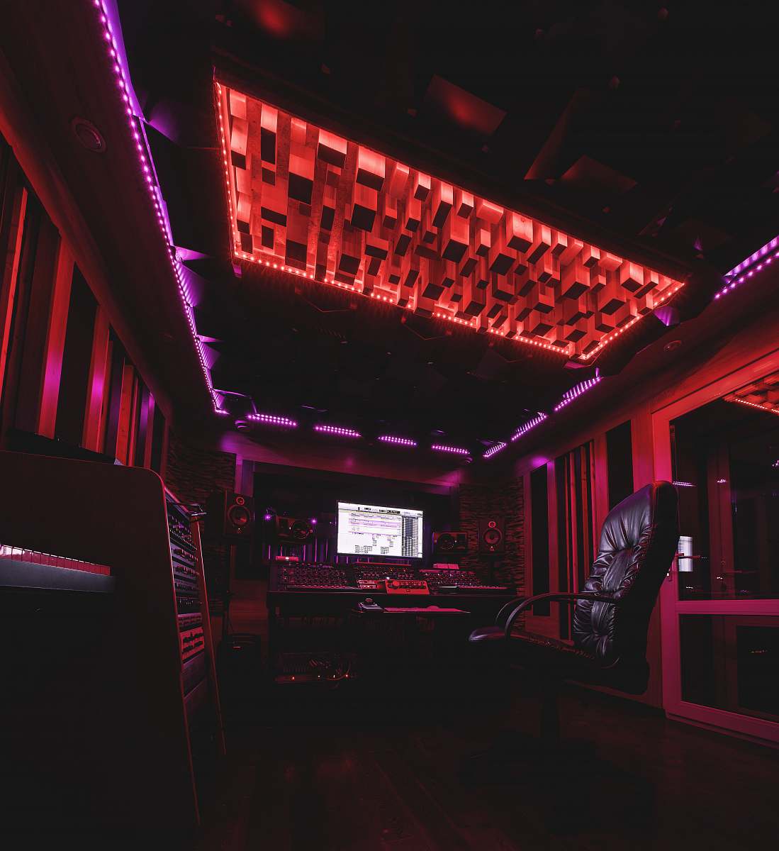 club black and silver chair near red wall night club