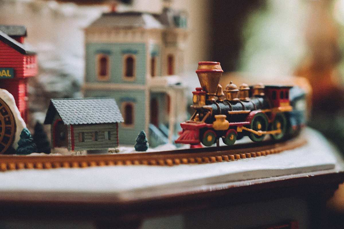 train selective focus photography of village miniature transportation