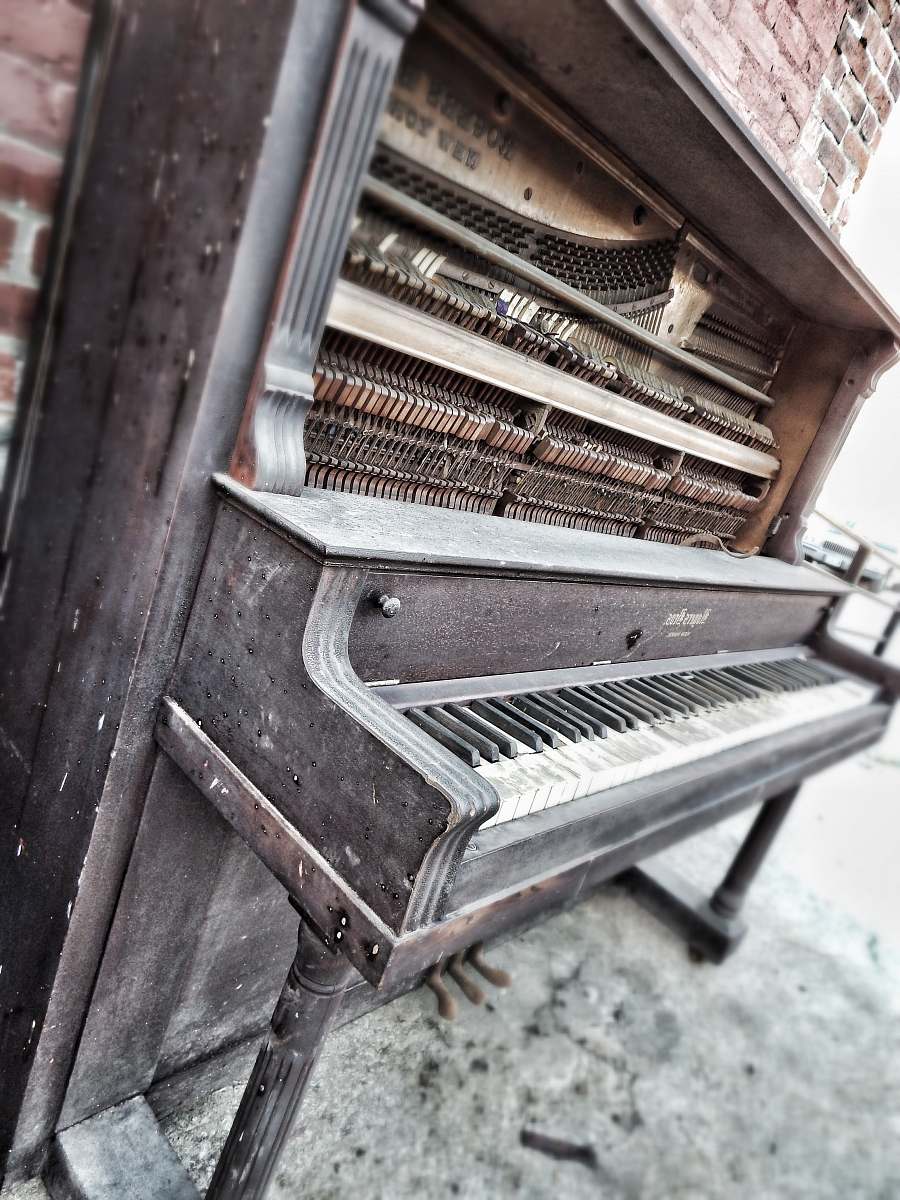 grey black and brown upright piano west bottoms
