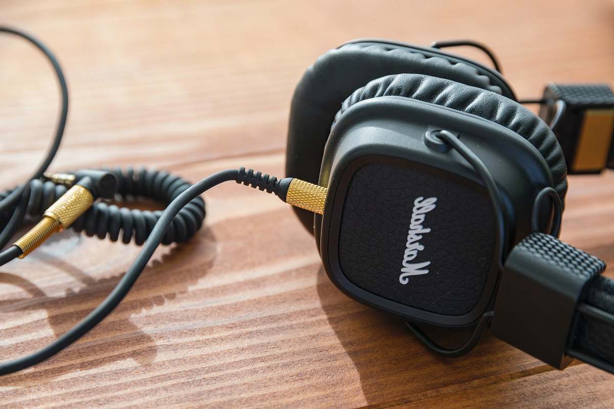 headphones black Marshall headphones on wooden table marshall