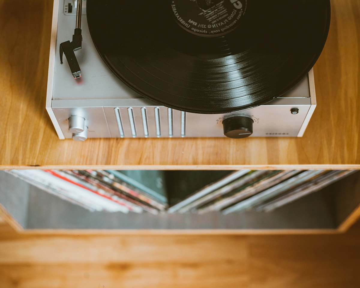 vinyl gray turntable on brown wooden table record