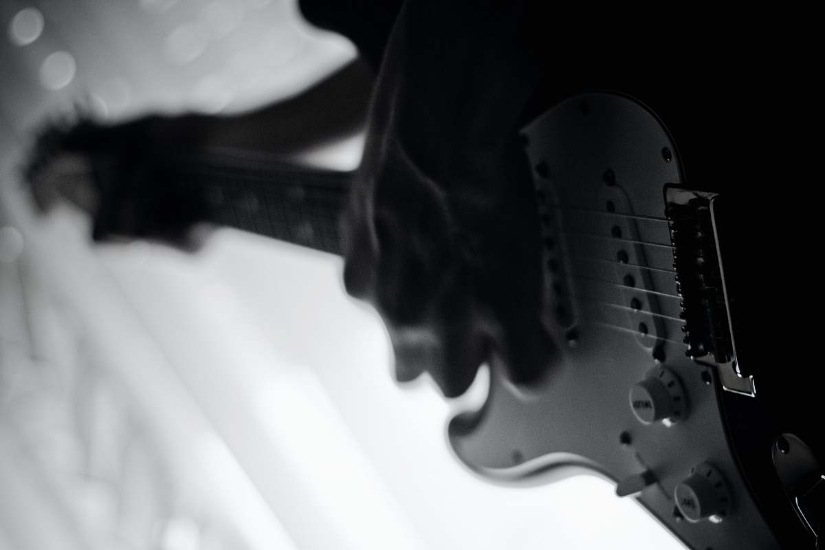 guitar grayscale photo of person playing electric guitar black-and-white