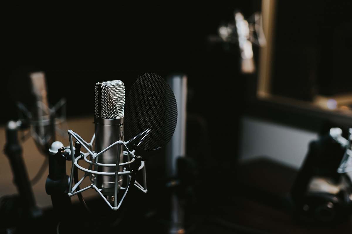 podcast macro photography of silver and black studio microphone condenser studio