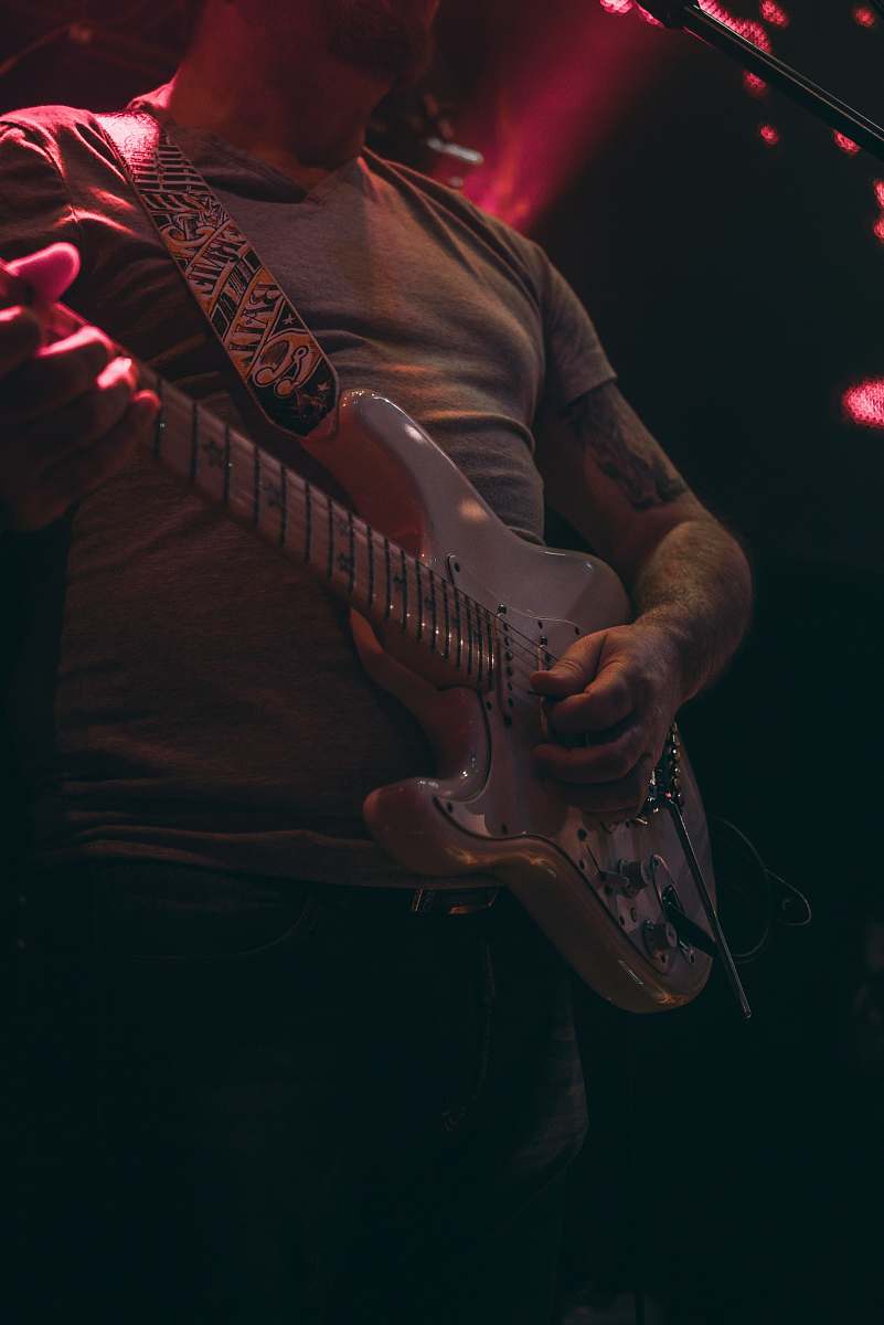 guitar man playing electric guitar on stage person