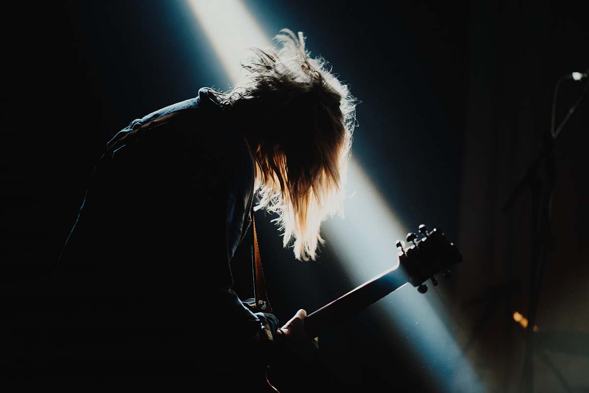concert man playing guitar guitarist